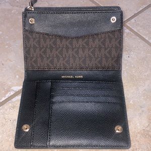 Michael Kors wallet. 5 1/2 inches long and 4 inches tall